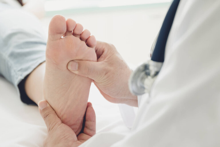 Podiatrist holding foot