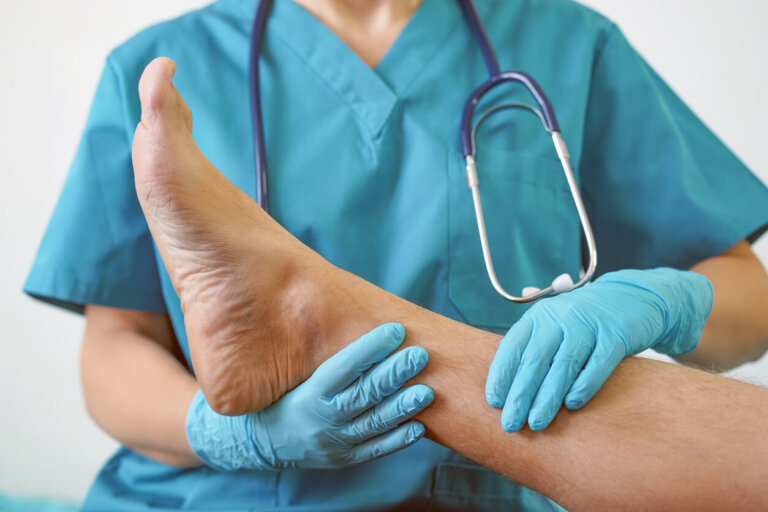 Doctor examining foot