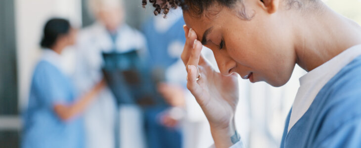 Black woman, nurse and fatigue in burnout, grief or mistake against glass window in hospital building. Frustrated physician, medical healthcare and person in stress, loss or headache at clinic